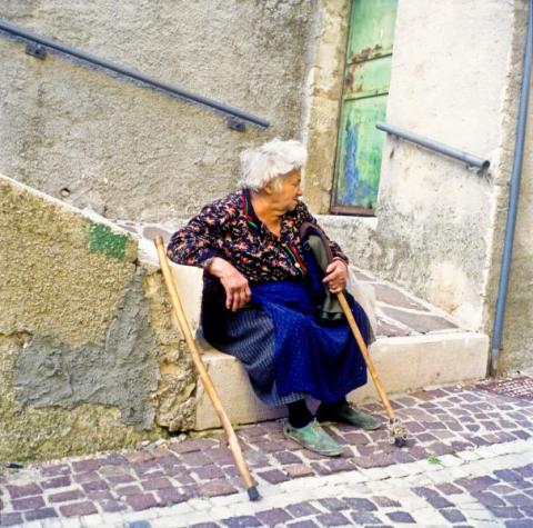 Woman Sat in Miranda, Italy